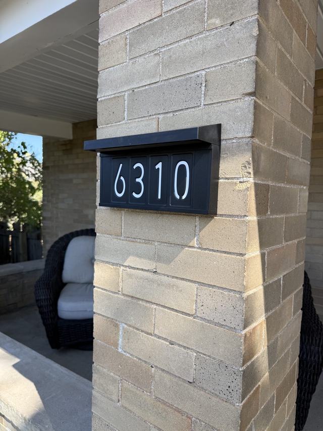 House number 6310 on the brick porch pillar